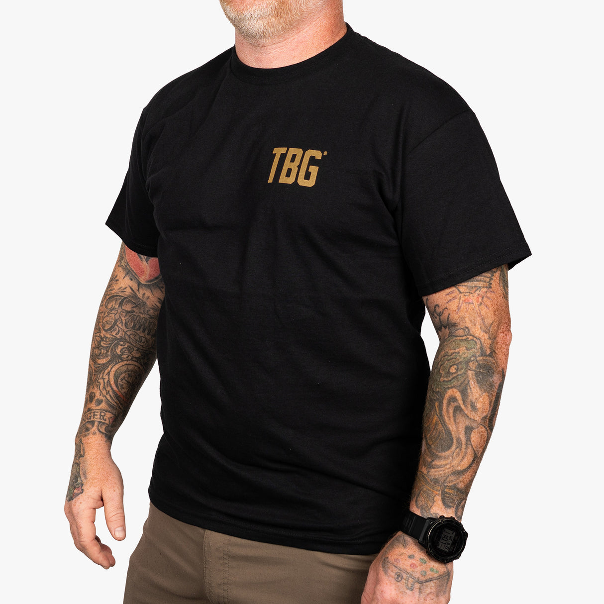 Black T-shirt featuring "God, Guns & Diapers" design, ideal for rugged parenting enthusiasts.