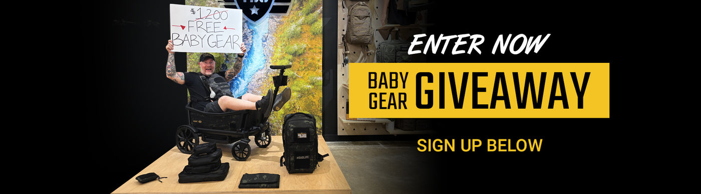 Baby gear giveaway promotion with stroller, car seat, and sign on a table.