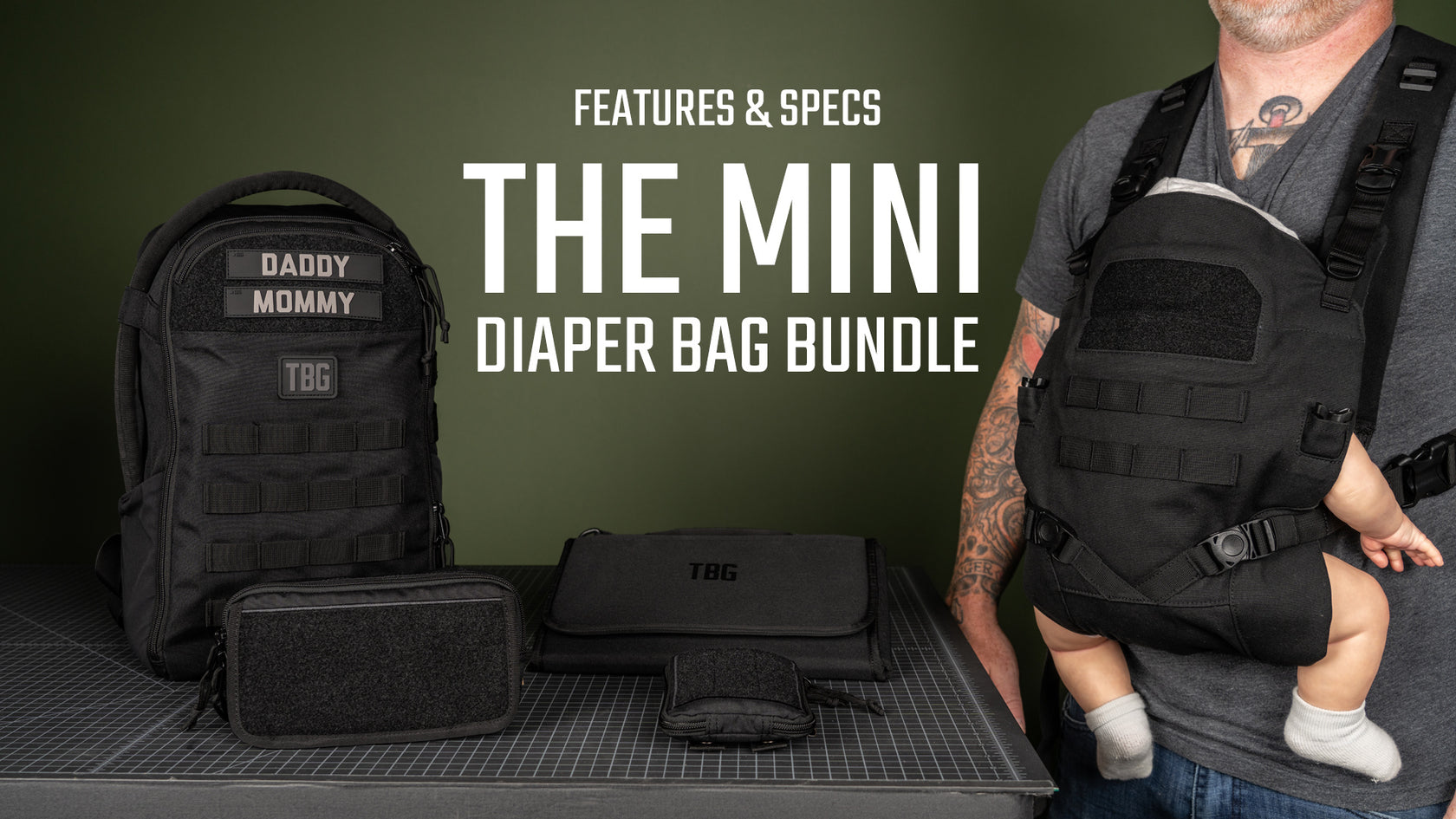 Black tactical diaper bag bundle with backpack, carrier, and accessories on a dark green background.