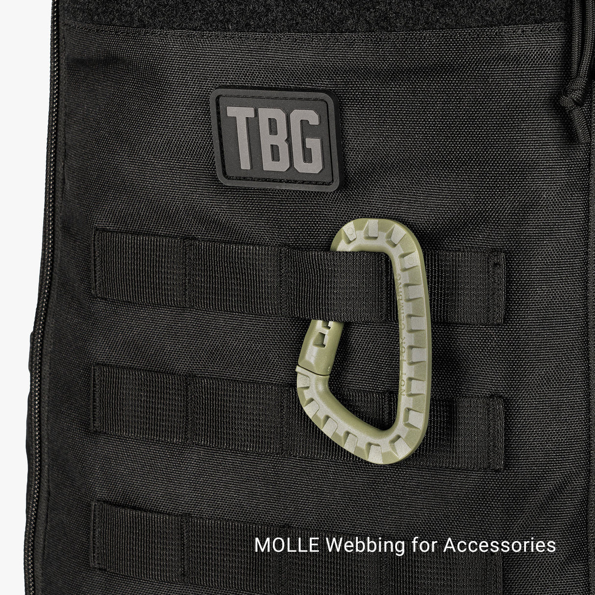 Close-up of Tactical Baby Gear Daypack Mini featuring MOLLE webbing and a carabiner for attaching accessories.