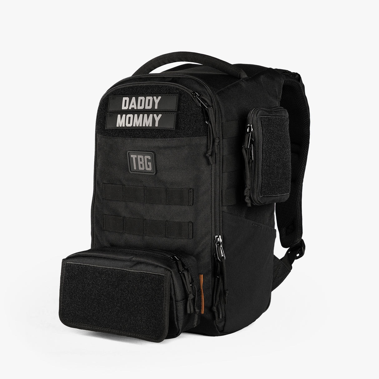 Rugged mini diaper bag with adjustable straps, featuring patches labeled "DADDY" and "MOMMY" and multiple storage compartments.