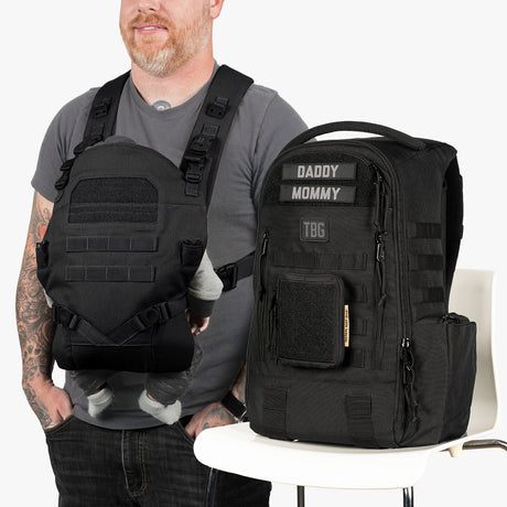 Black tactical diaper bag and baby carrier bundle with labeled patches for daddy and mommy, designed for parents on the go.