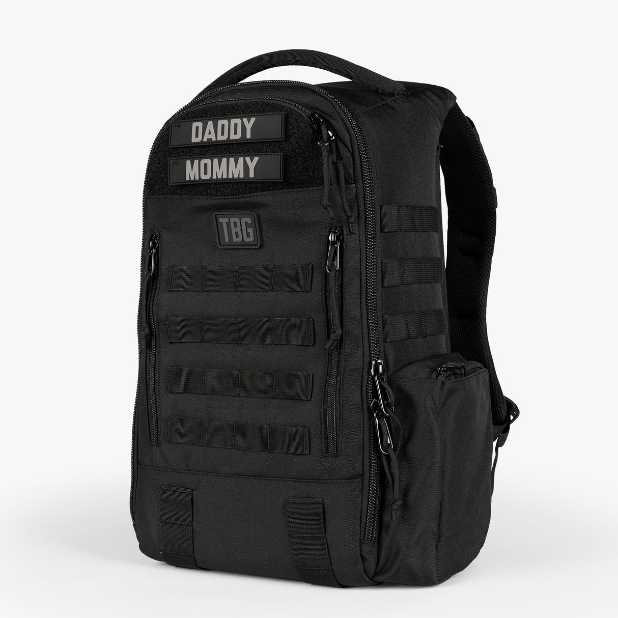 Black daypack diaper bag with multiple compartments, adjustable straps, and patches labeled Daddy and Mommy.