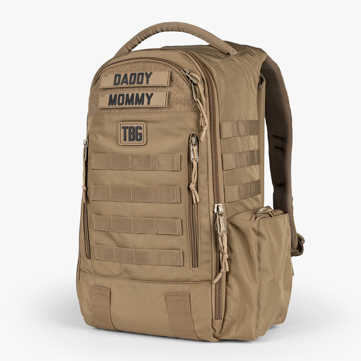 Tactical Baby Gear daypack diaper bag in tan with multiple zippered compartments, MOLLE webbing, and a top handle for easy carrying.