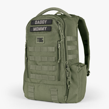 Olive green tactical diaper bag with multiple compartments, adjustable straps, and patches labeled Daddy and Mommy.