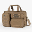 Tactical Baby Gear Deuce Diaper Bag in tan with multiple compartments, Velcro patches for labels, and a shoulder strap.