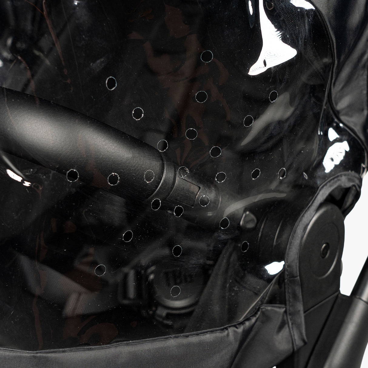 Clear S-1 Rain Cover for strollers with ventilation holes, designed for rugged outdoor use by parents.