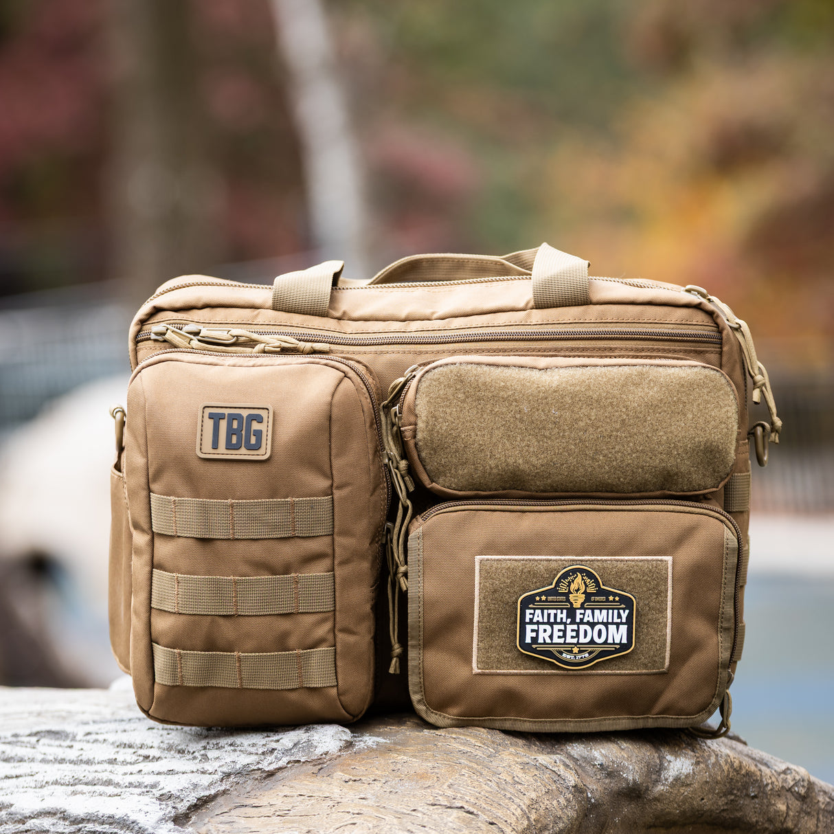 Rugged tactical diaper bag featuring a "Faith, Family, Freedom" patch, designed for modern parents.