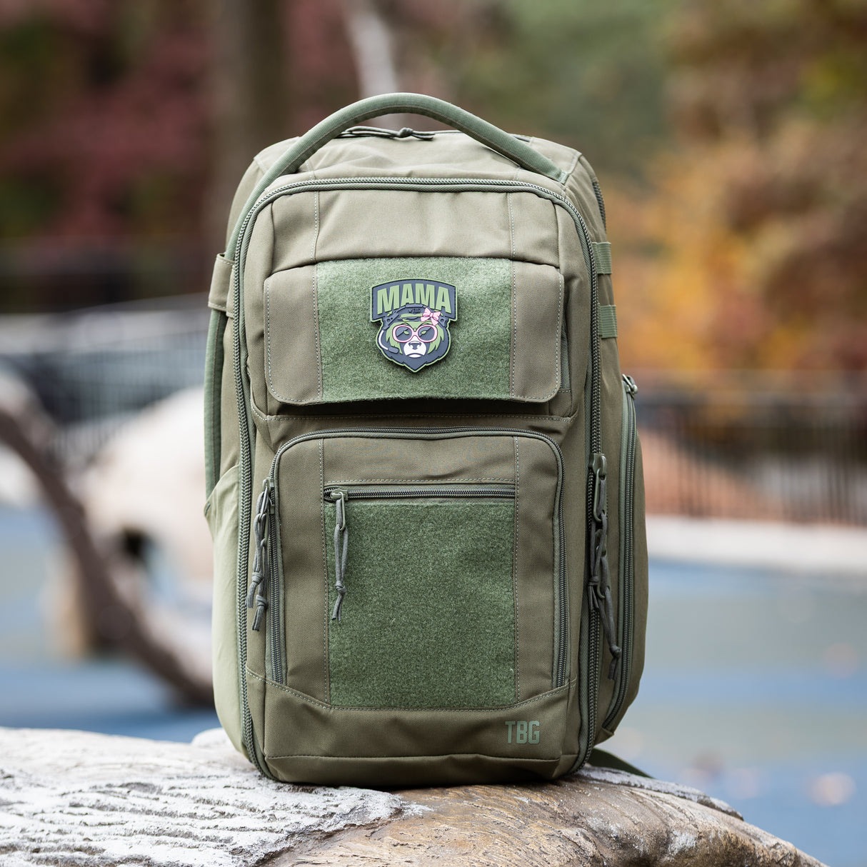 Mama Bear Patch on a rugged green backpack, designed for modern parents with military-inspired style.
