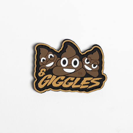 Embroidered patch reading "Shits & Giggles" in stylized white font on a black background, with decorative stars and a smiley face.