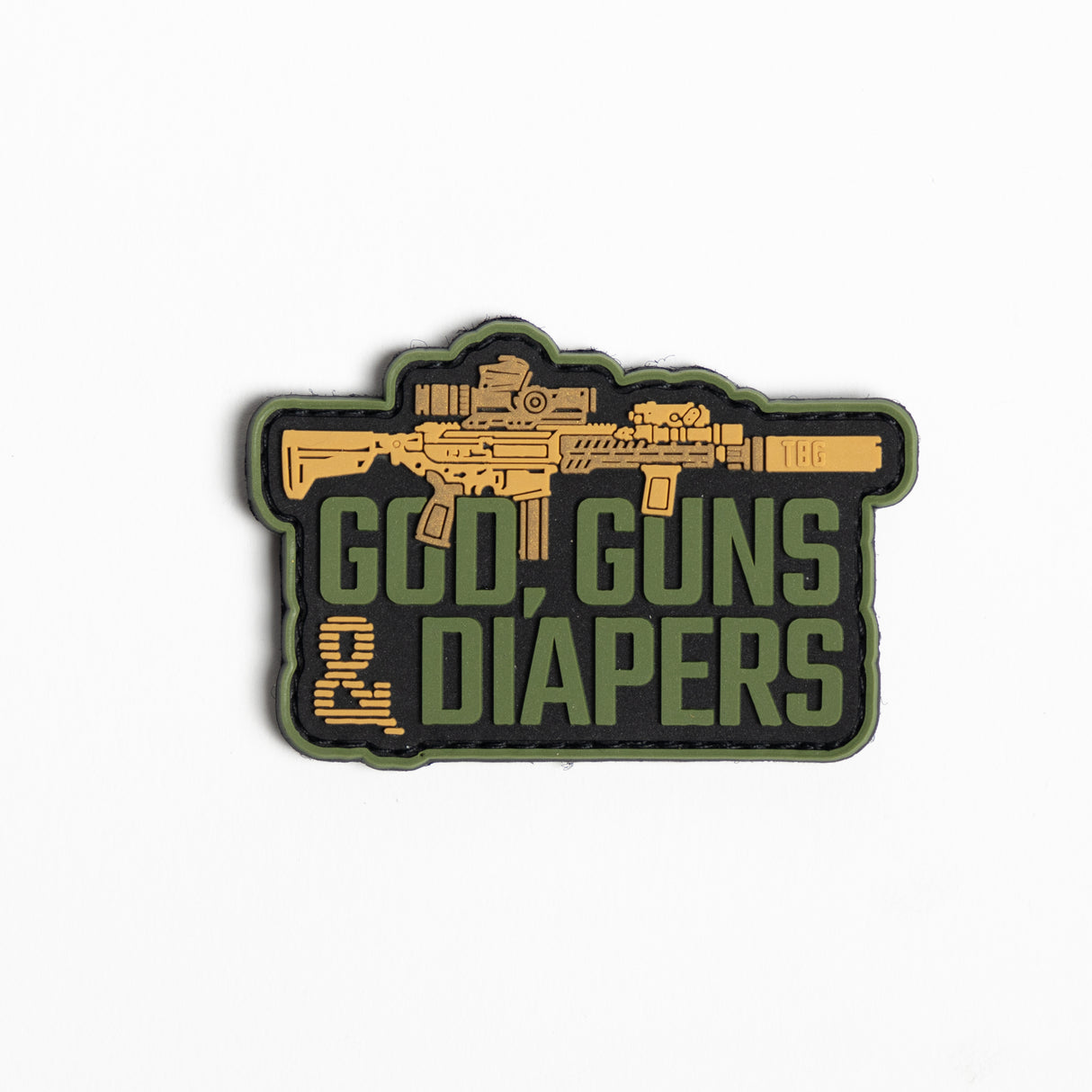 Morale patch featuring the text "God, Guns & Diapers" with an AR-style rifle design, styled in military colors.