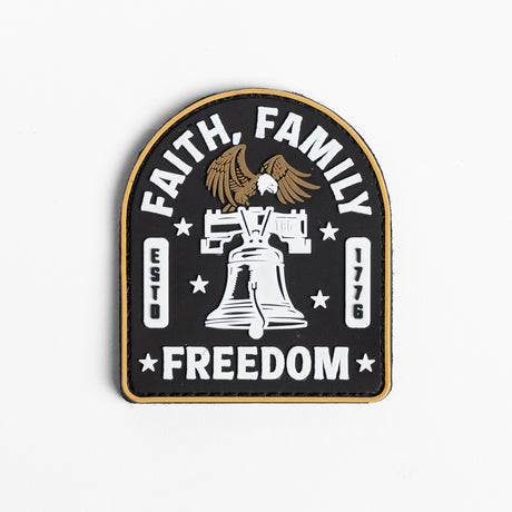 Embroidered patch featuring the words "Faith, Family, Freedom" in a circular design with an American flag motif in the background.