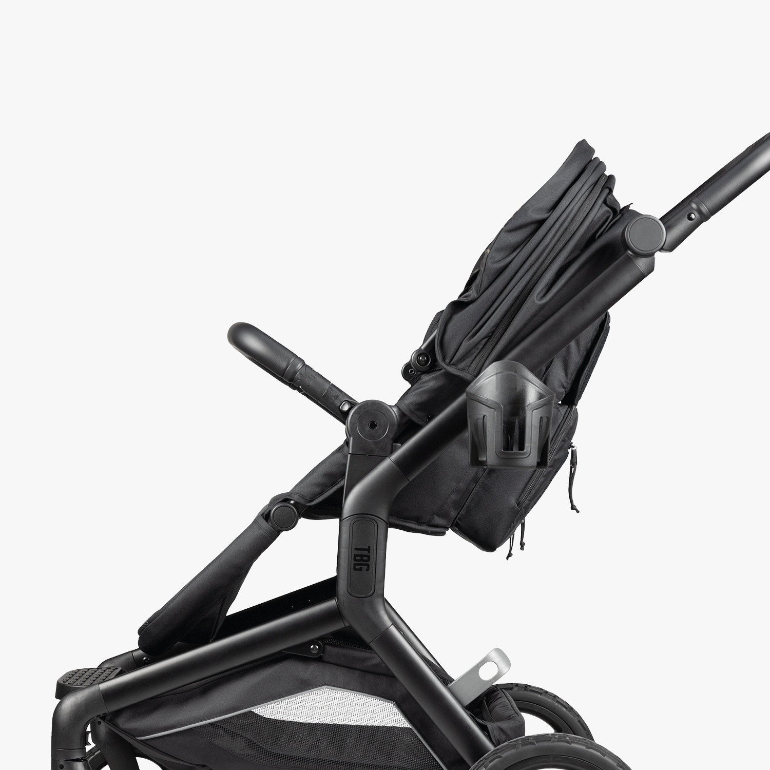 Black tactical baby stroller with multiple compartments and adjustable handles.