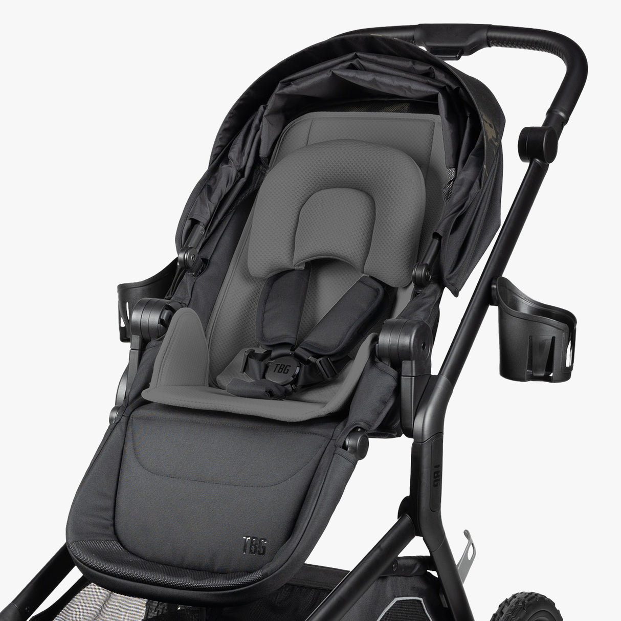 Gray stroller with adjustable seat, padded headrest, and harness for newborns, featuring a sturdy black frame and storage basket.
