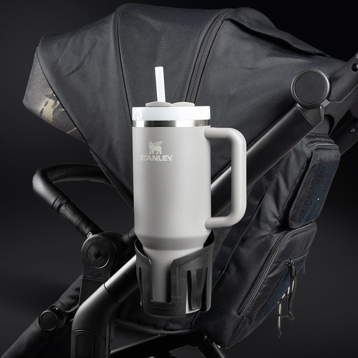 "Stanley steel mug attached to a stroller, showcasing durable design and utility for active parents."