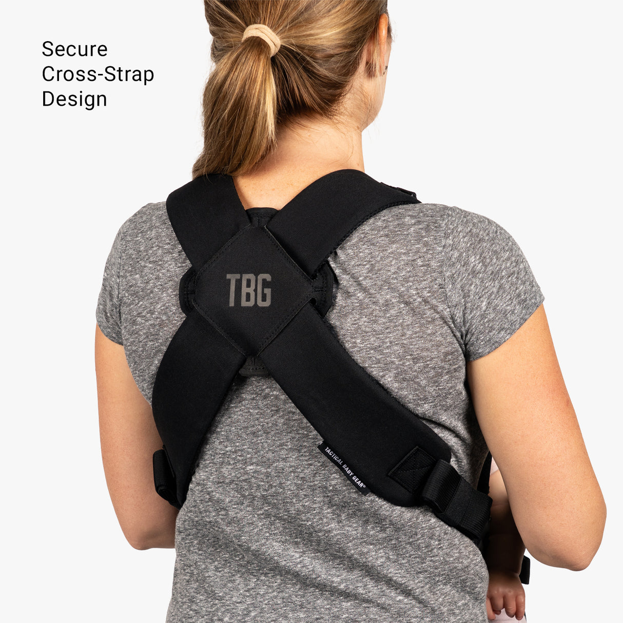 Mini diaper bag and baby carrier bundle featuring a secure cross-strap design for comfortable carrying.