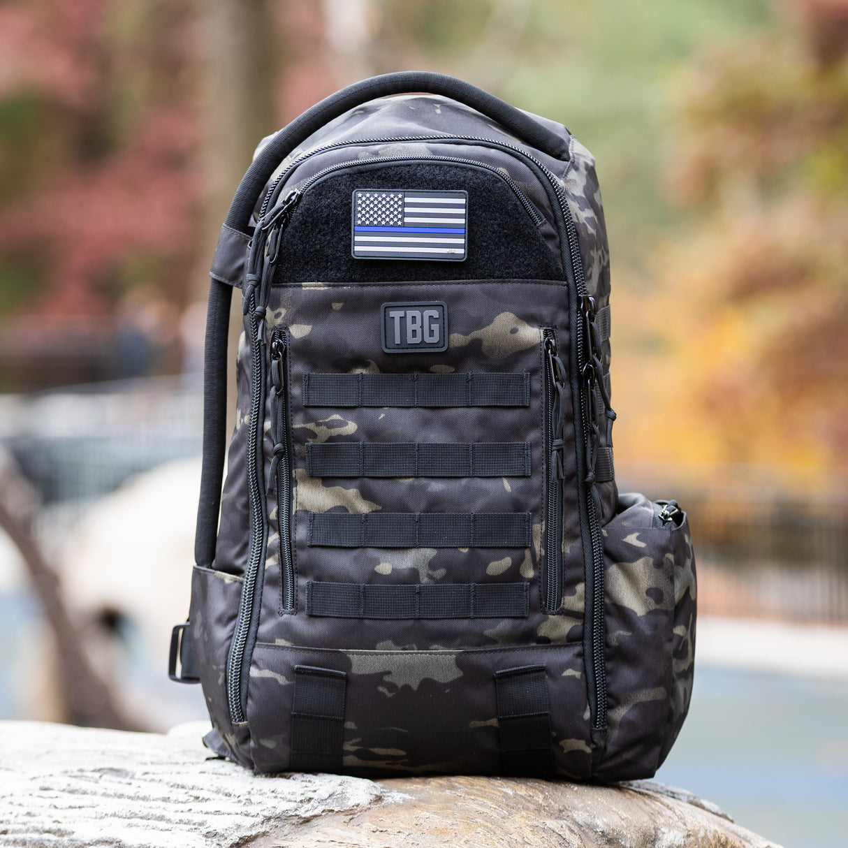 Thin Blue Line USA flag patch on a rugged Tactical Baby Gear backpack, showcasing military-inspired design and functionality.