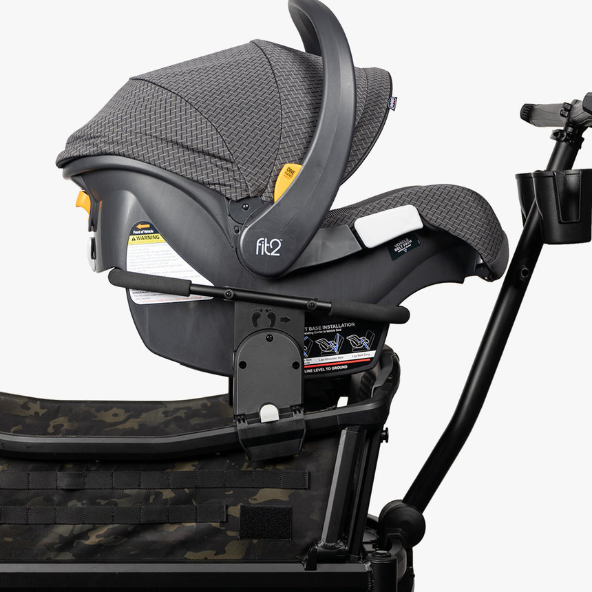 Adapter attached to a stroller designed to hold a Chicco car seat, on a plain background.
