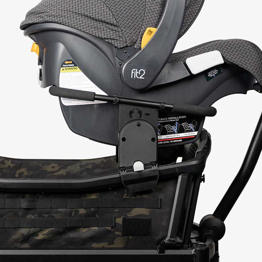 Alt text: Adapter attached to a Cruiser XL stroller to fit a Chicco car seat, displayed on a white background.