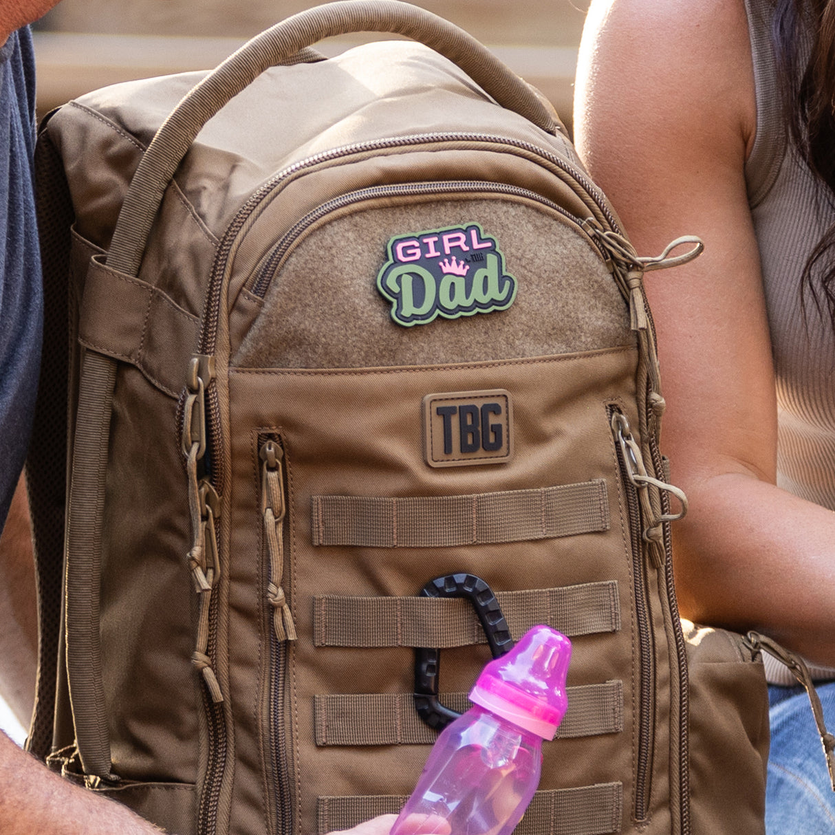 Colorful "Girl Dad" patch on a rugged backpack, showcasing a proud dad's parenting style. Ideal for modern fathers.