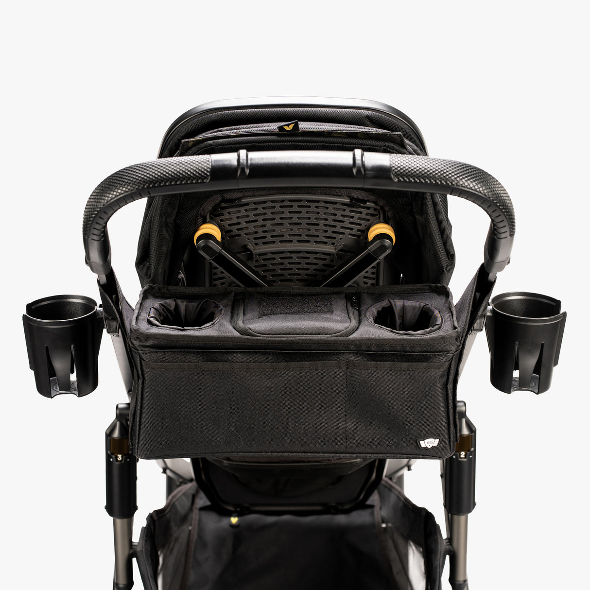 Car dashboard organizer with cupholders and snack compartments, designed for convenient access while driving.