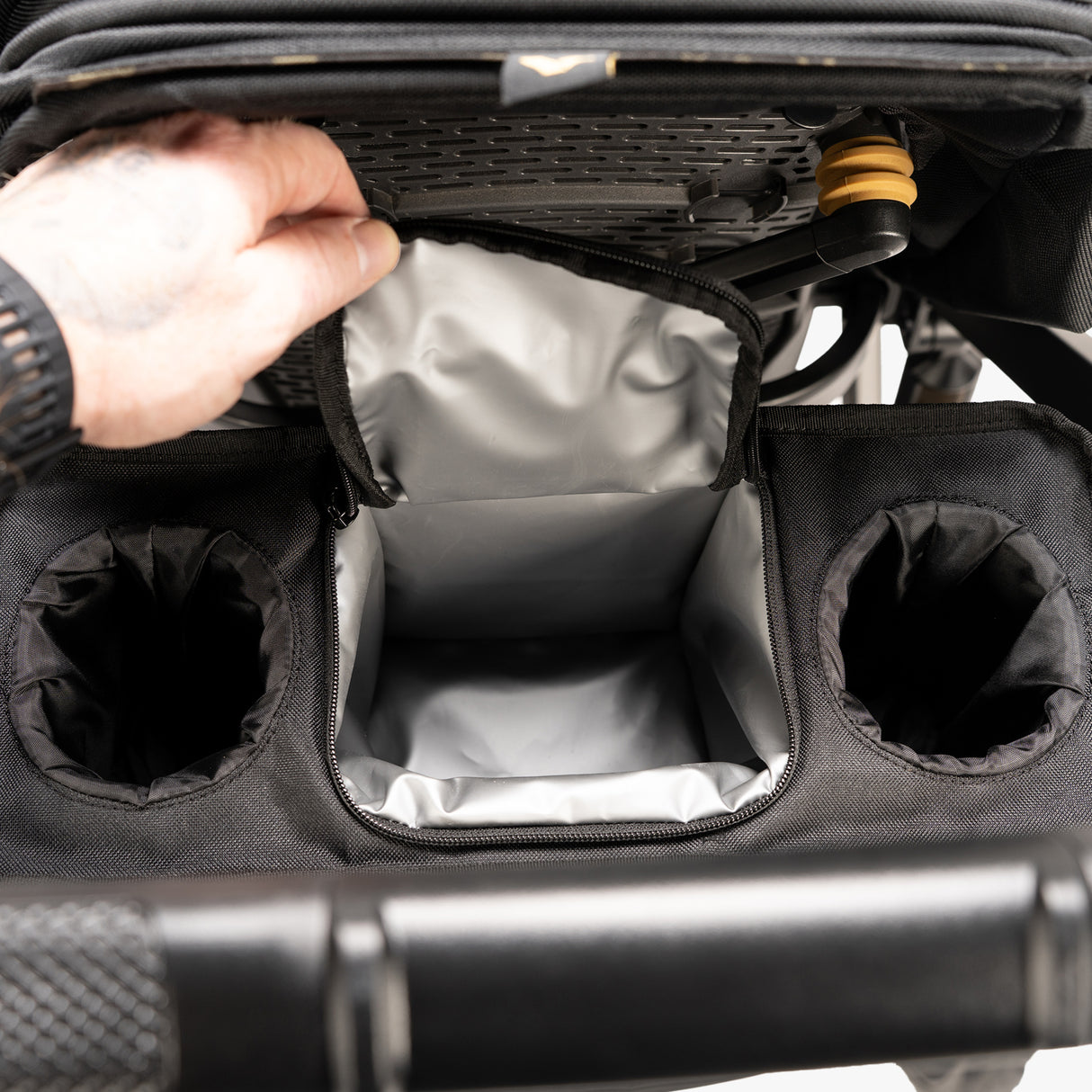 Open Switchback Snack Pack displaying assorted nuts and dried fruits on a table.