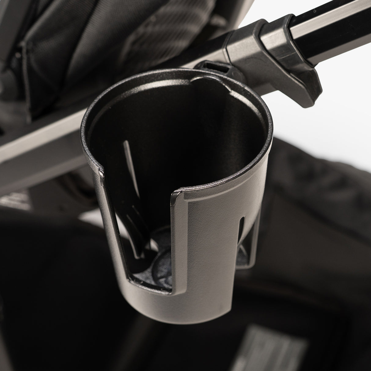 Car cup holder containing a Switchback Snack Pack with a variety of nuts and dried fruits.