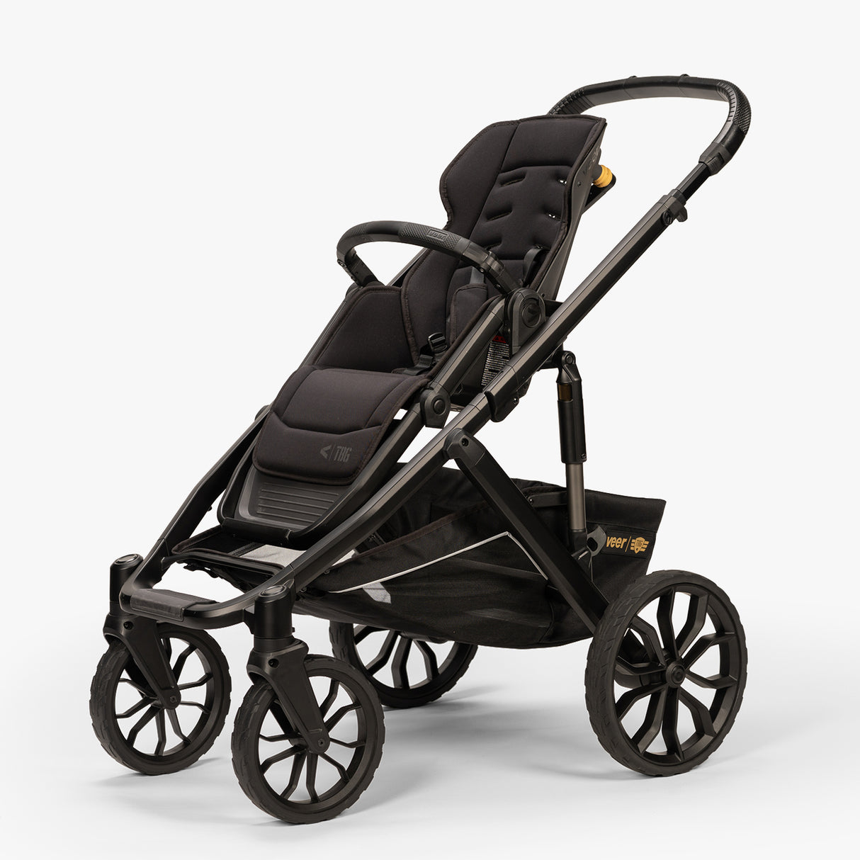 Three-quarter view of TBG Veer Switchback Stroller in seat mode with its canopy open, positioned on a plain background.