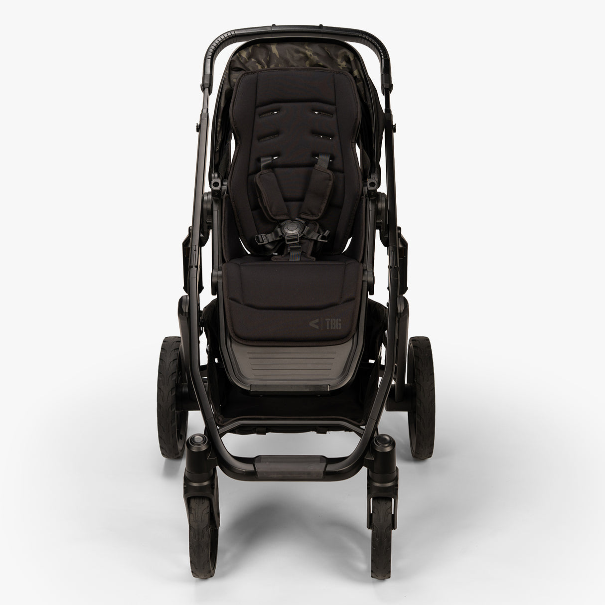 A TBG Veer Switchback Stroller in front-top view, featuring rugged wheels and a sleek design with storage basket.