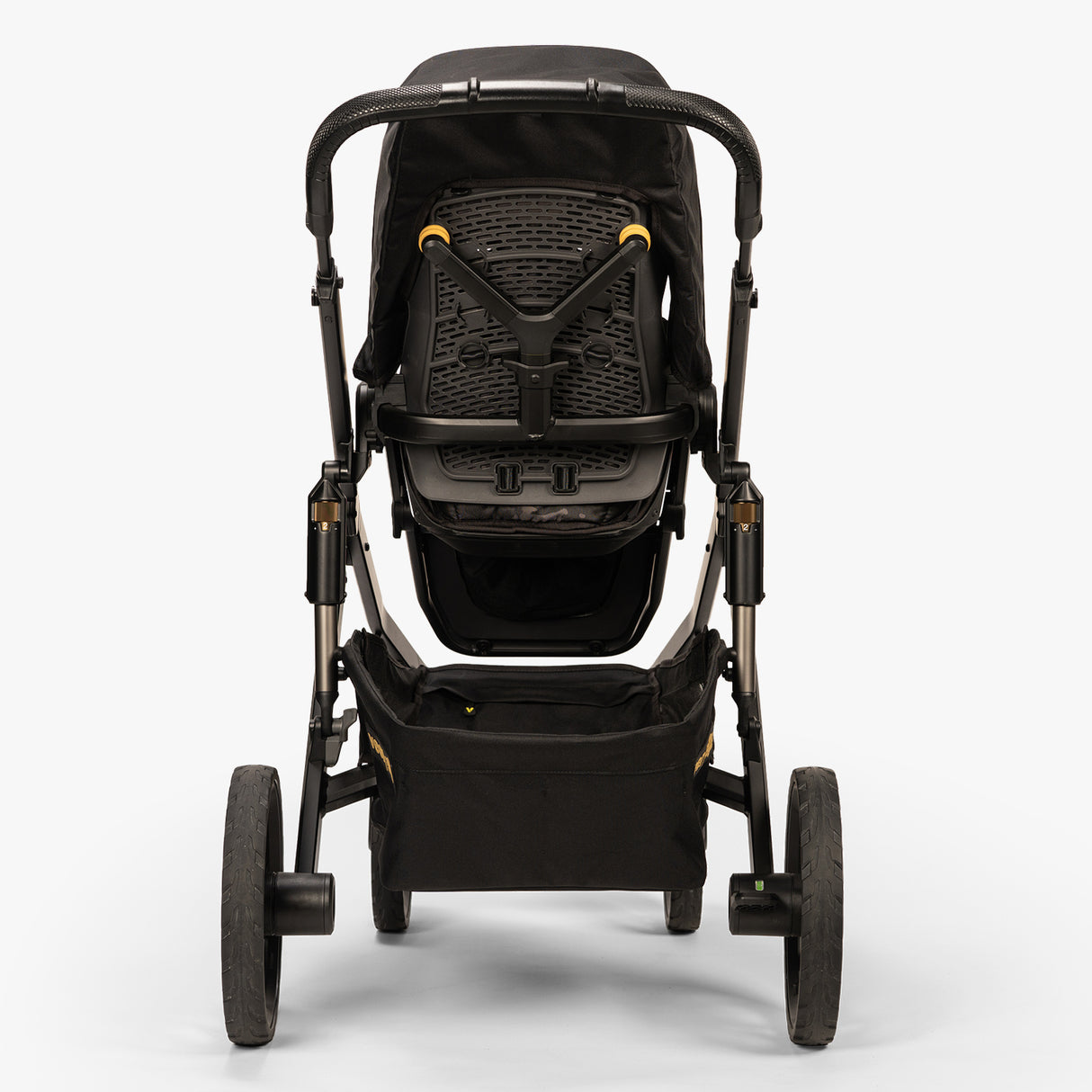 Baby carrier system displayed with newborn bundle accessories including a rear-facing carrier and attachment elements, focused on ergonomic design, in a neutral color palette.
