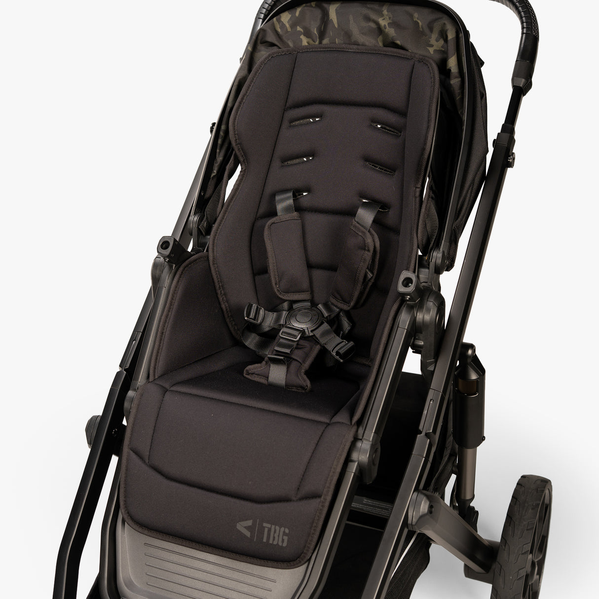 Baby carrier with an infant insert and sun hood, shown in a three-quarter view on a white background.
