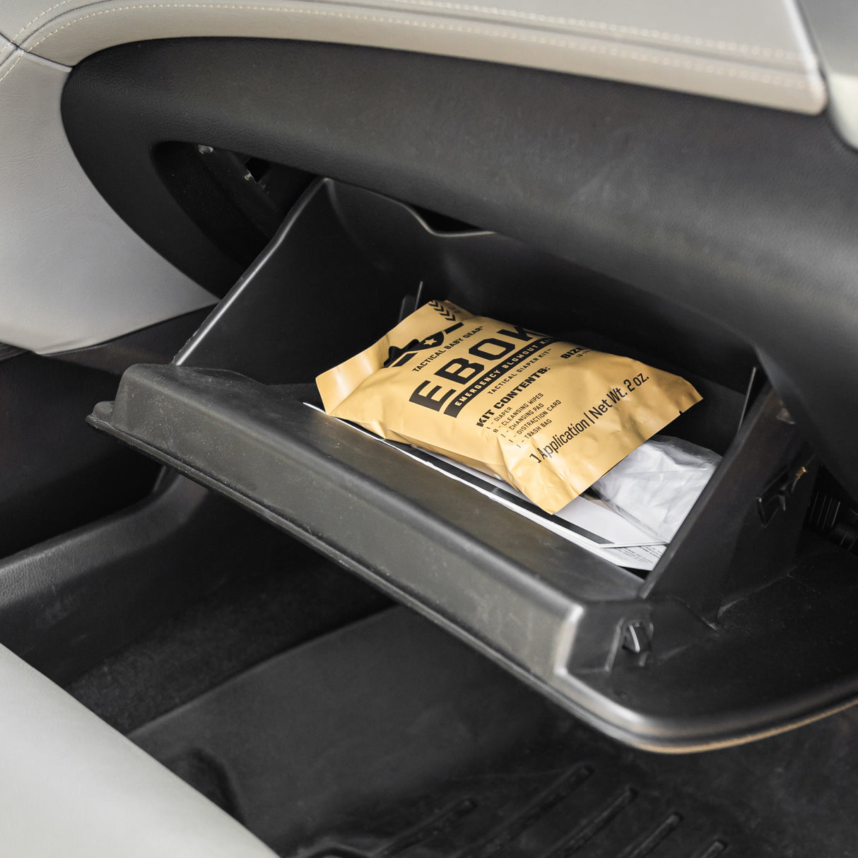 An EBOK show stored in a car's glove compartment.