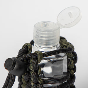 opened sanitizer bottle in paracord germ grenade