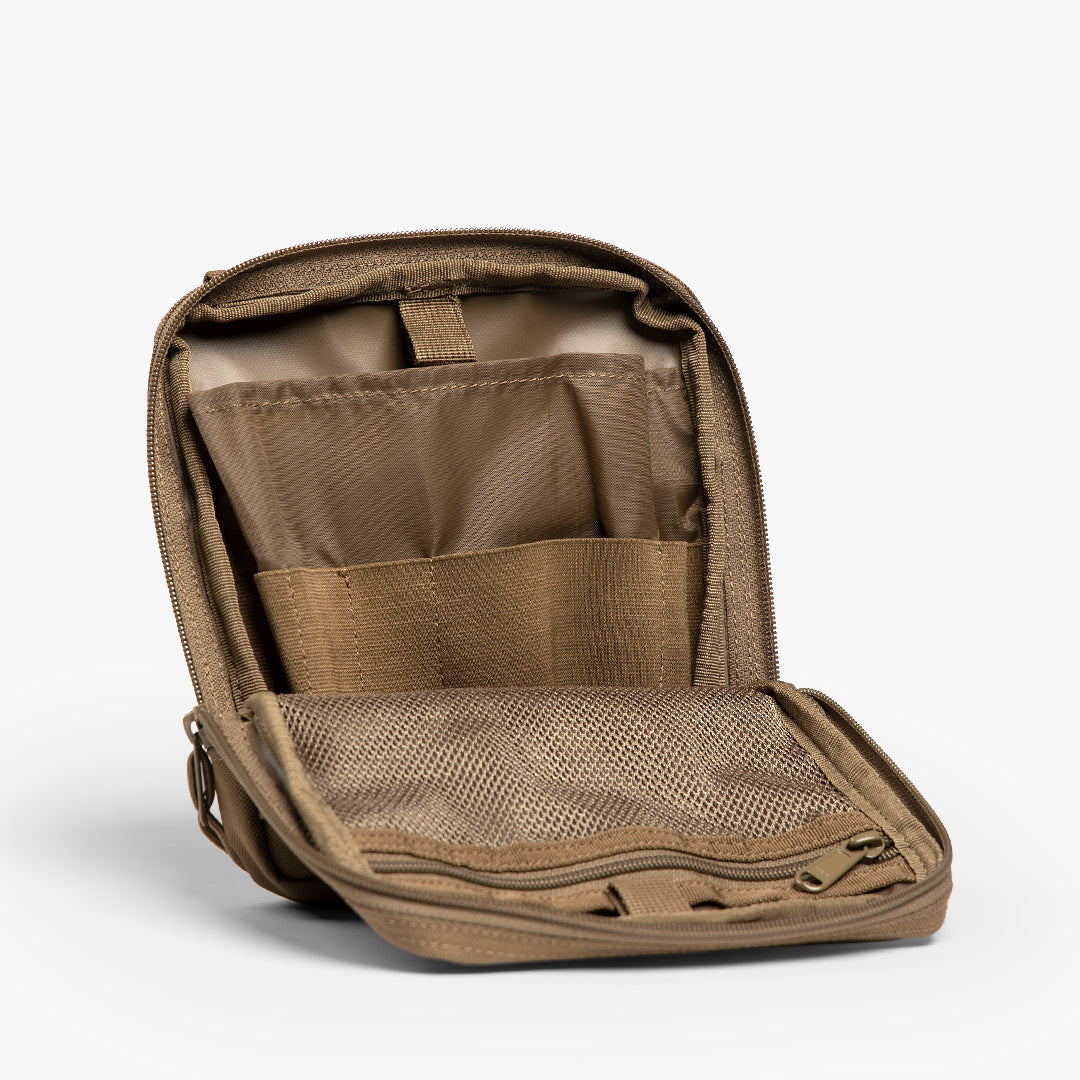 Opened utility pouch showing variety of pockets