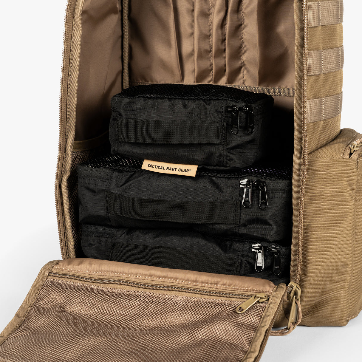 Tactical Packing Cubes Bundle neatly organized inside a tactical backpack, showcasing durable black fabric and zippers.