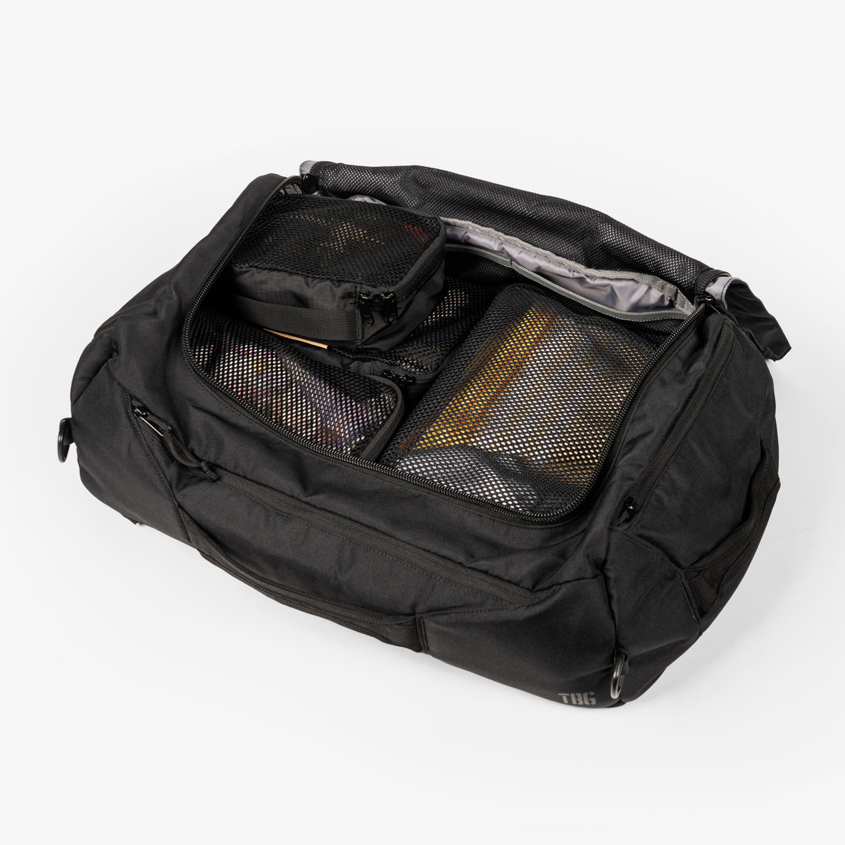 Tactical Packing Cubes Bundle inside a black duffel bag, featuring organized compartments for efficient storage.