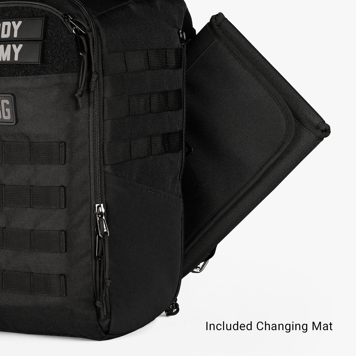Compact black Daypack Mini featuring a side pocket for an included changing mat, ideal for on-the-go parents.