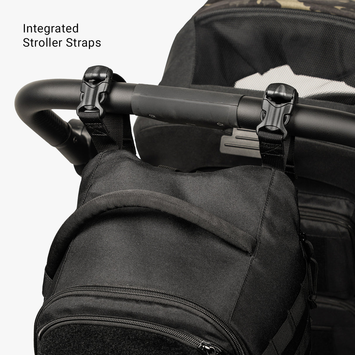 Compact black Daypack Mini with integrated stroller straps, designed for easy attachment to strollers.