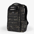 Camouflage tactical daypack diaper bag with multiple compartments, adjustable straps, and labeled for parents.