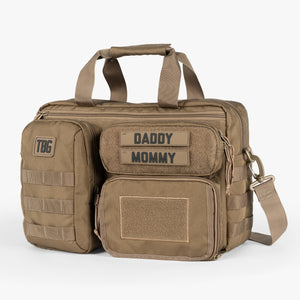 Tactical Baby Gear Deuce Diaper Bag in tan with multiple compartments, Velcro patches for labels, and a shoulder strap., Men's Diaper Bag