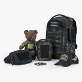 Tactical Baby Gear Father's Day Loadout featuring a camo backpack, tactical pouches, a plush bear, and a cap.