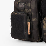 Rugged Deuce Diaper Bag with camouflage pattern and tactical patches for modern parents on the go.