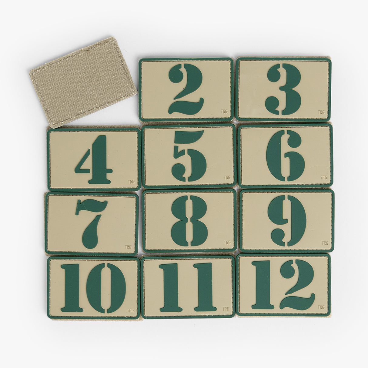 Tactical Teddy® number patch set featuring twelve durable patches with bold green numbers on a tan background.