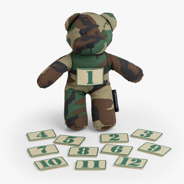 Camo-patterned Tactical Teddy with removable number patches, perfect for playful learning and rugged parenting.