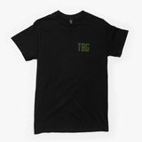 Black T-shirt featuring a small green TBG logo on the front, designed for modern parents with a rugged style.