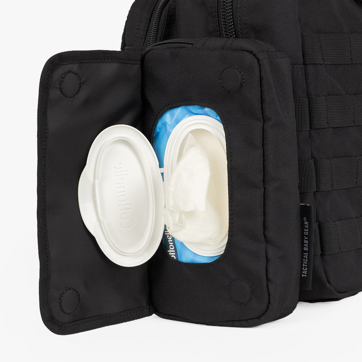 Tactical Wipe Pouch® featuring an open lid revealing wipes inside, designed for rugged parenting convenience.
