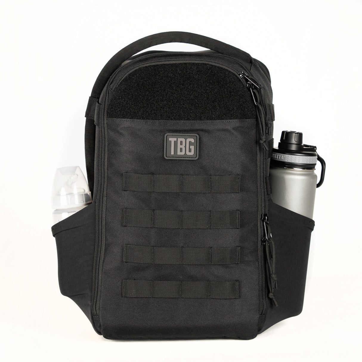 Compact black daypack with multiple pockets, designed for parents, featuring a water bottle holder and baby carrier attachment.