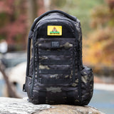 Tactical Baby Gear backpack featuring a humorous "Don't Poop On Me" patch, designed for rugged parenting.