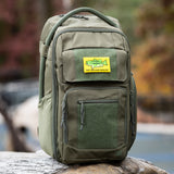 Rugged green backpack featuring a "Don't Tread on My Fishing Spot" patch, ideal for outdoor enthusiasts and parents.