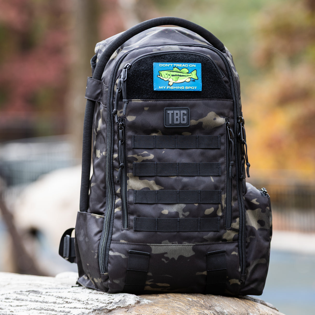 Rugged tactical backpack featuring "Don't Tread on My Fishing Spot" patch, ideal for outdoor adventures and fishing trips.